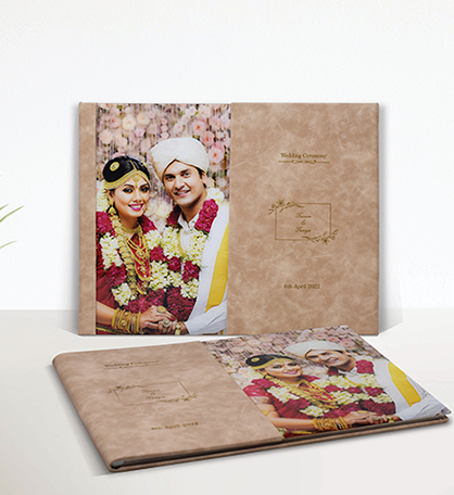 Printed wedding album displaying photographs of a traditional wedding couple and ceremony