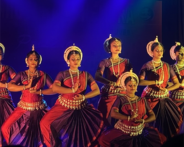 Bharatanatyam photoshoot capturing dancers, traditional costumes, poses and stage moments
