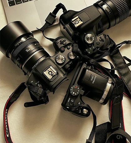 Professional cameras and lenses arranged for complete event photography coverage
