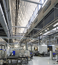 Modern industrial facility interior showing production equipment and factory workspaces